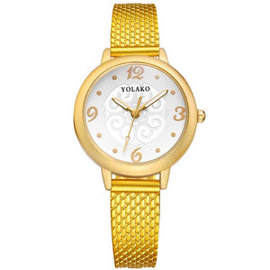 gold color wristwatch